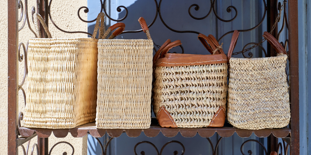 Handwoven straw market baskets and bags at a Nice Old Town shop