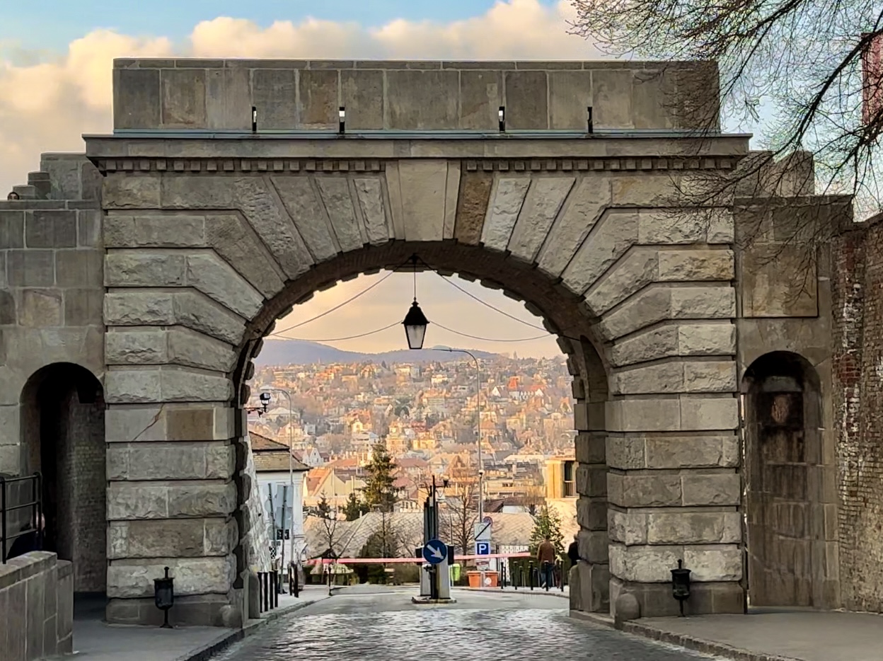 Historic stone gate in the Buda Castle District with city views