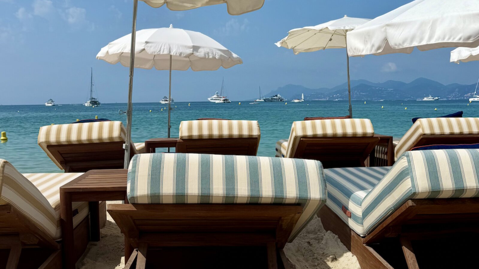 Sun loungers and umbrellas on the beach in Cannes, France
