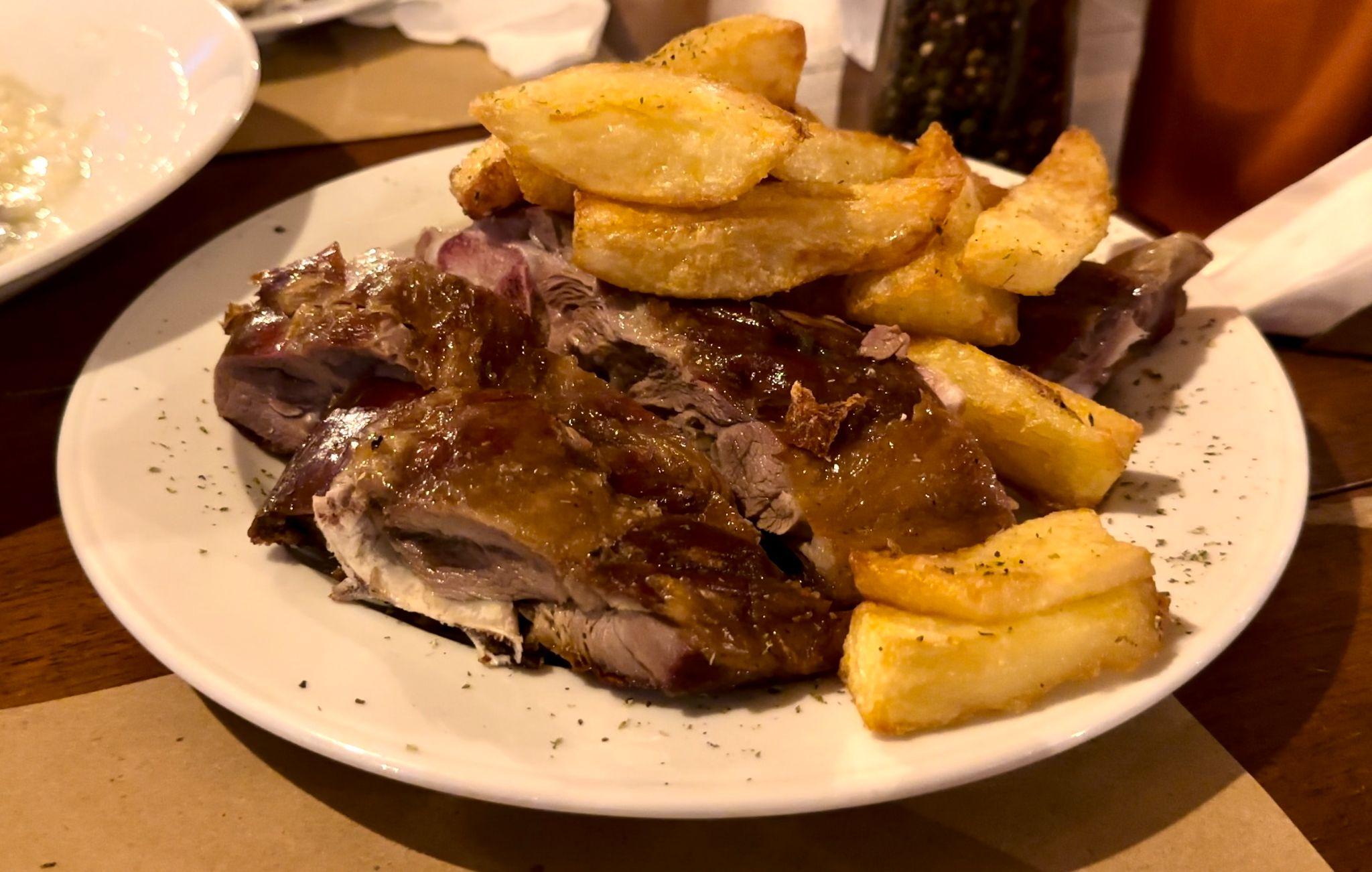 Lamb antikristo with crispy potatoes at Kanelis Tavern in Platanias, Crete