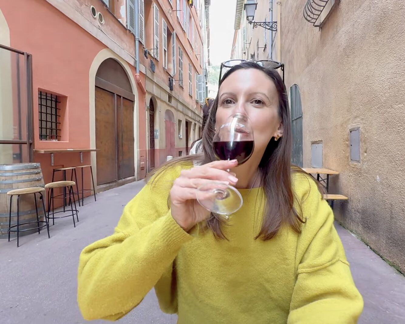 Woman drinking a glass of wine at Barrique, Nice, France
