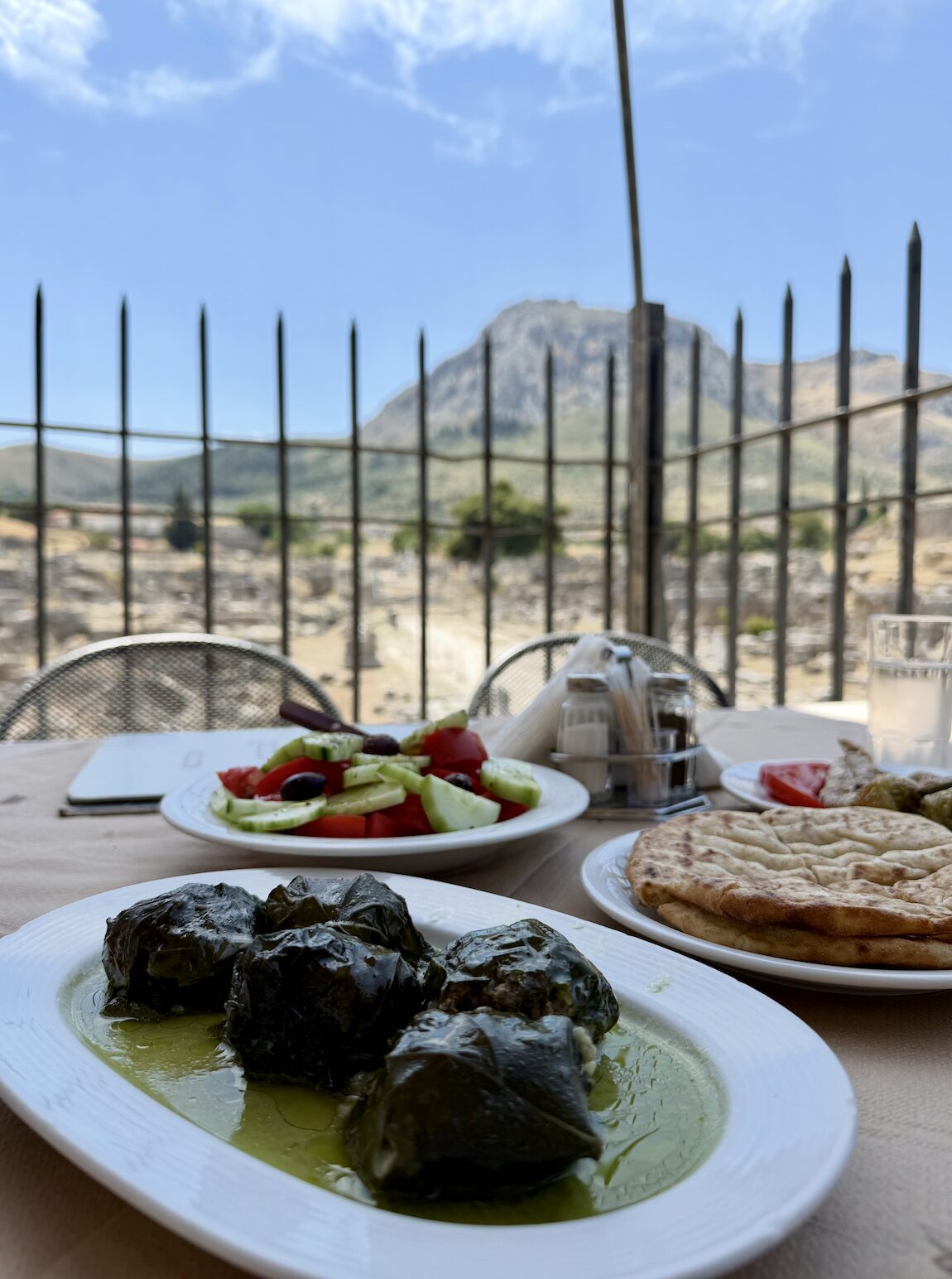 A meal with a view over the ancient ruins of Corinth, Greece
